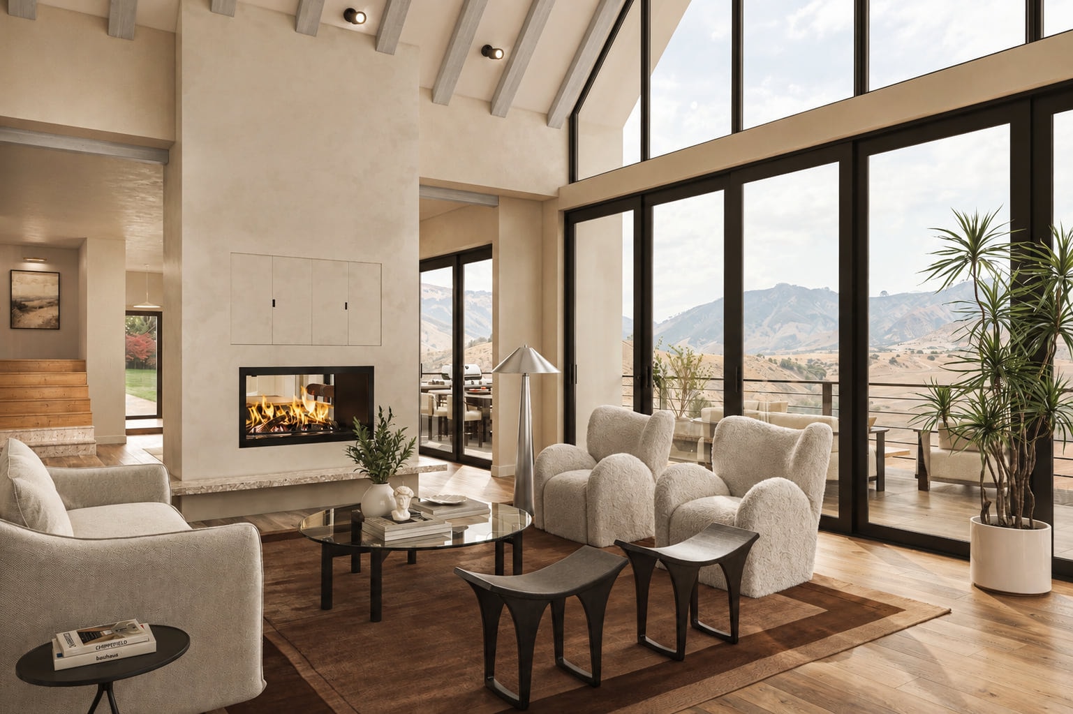 Rendering of the Crane Creek Residence great room: a vaulted ceiling with exposed beams, a two-sided fireplace set in a plaster chimney, and floor-to-ceiling glazing opening to a terrace with hills beyond.